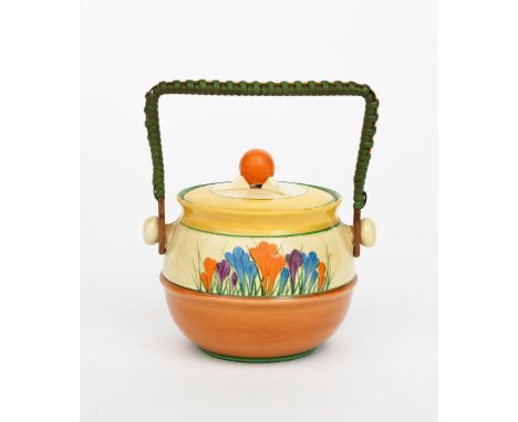'Crocus' a Clarice Cliff Bizarre biscuit barrel and cover, shape no.335, painted in colours between brown and yellow bands, w