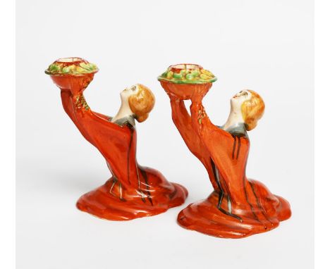 'Delecia Girl' a pair of Clarice Cliff figural candlesticks, modelled in relief and painted in colours various printed factor