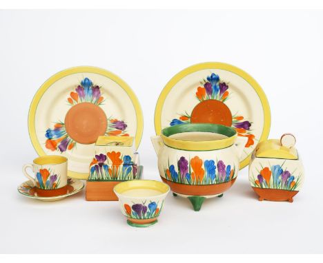 'Crocus' a Clarice Cliff Bizarre large Cauldron, painted in colours between yellow and brown bands, a Crocus candlestick, a B