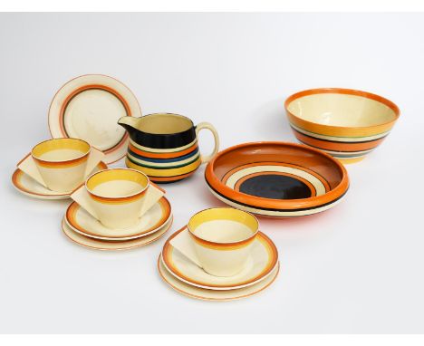 'Liberty Band' a Clarice Cliff Bizarre jug, painted with bands in colours, a 'Liberty Band Hiawatha' bowl, another bowl a par