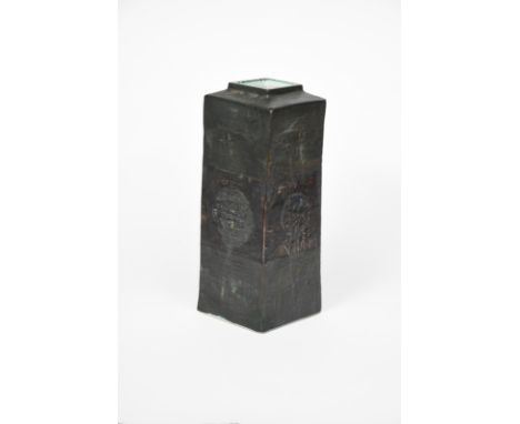 A Troika Pottery Column vase, rectangular form with square neck, modelled in low relief and painted with geometric panels in 