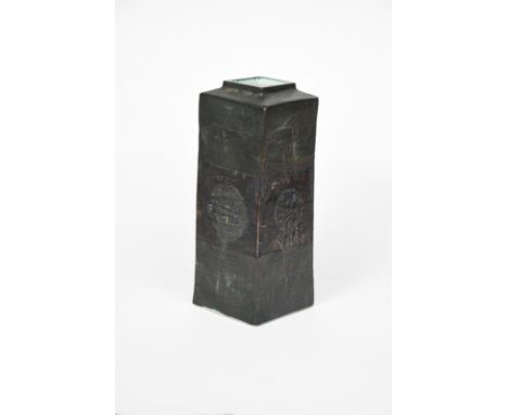 A Troika Pottery Column vase, rectangular form with square neck, modelled in low relief and painted with geometric panels in 