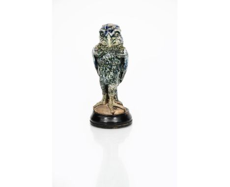 A small Martin Brothers stoneware bird jar and cover by Robert Wallace Martin, dated 1913, the small finch-like bird with hoo