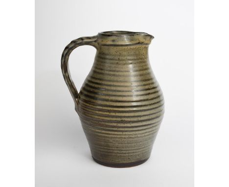 ‡ David Leach OBE (1911-2005) a Lowerdown Pottery stoneware bellied jug,  covered in a pitted ash glaze impressed seal mark, 
