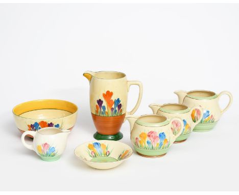 'Crocus' a Clarice Cliff Bizarre Coronet jug, painted in colours above brown and green bands, a Clarice Cliff Bizarre 'Crocus