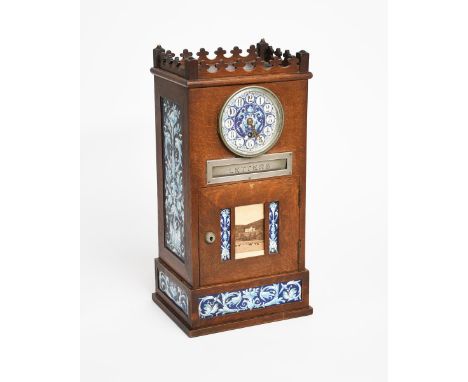 An Aesthetic Movement oak mantle clock with letter box in the manner of Lewis Foreman Day, rectangular form with trefoil over