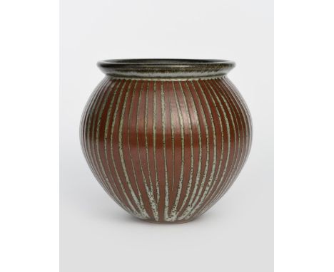 ‡ John Leach (born 1939) a Muchelney Pottery stoneware vase, swollen with collar rim, painted in resist with tenmoku and dolo