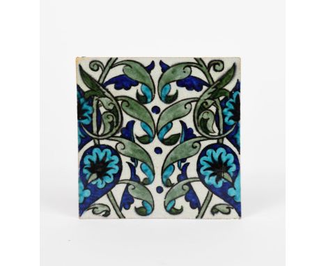 A William De Morgan Merton Abbey Period  Persian tile,  painted with scrolling flowers and foliage in blue, turquoise and gre