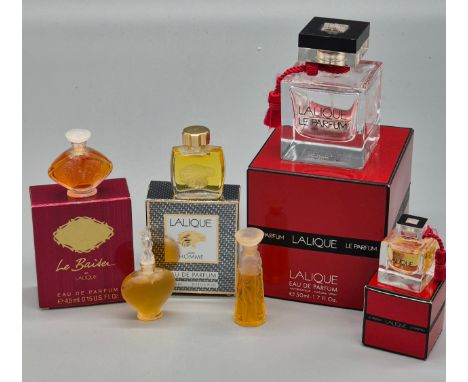 A Selection of vintage Lalique perfume bottles. Lalique Pour Homme. Le Baider de Lalique and various other miniature Perfumes