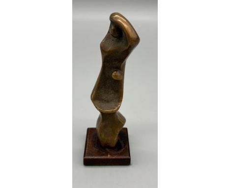 Mid century Bronze sculpture in the form of a parent and child in the manner of Henry Moore. Raised on a wooden block. 16.5cm