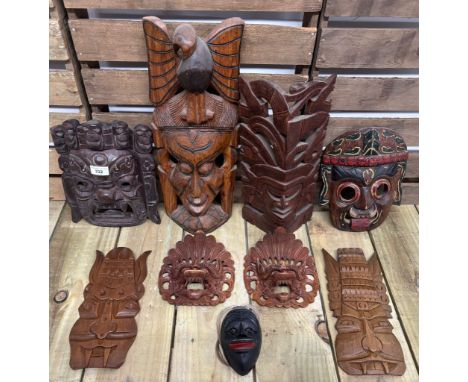 Selection of nine African tribal wall mount masks. 49cm largest. 