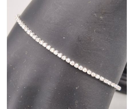 18ct white gold and diamond tennis bracelet. 1.09ct diamonds. 18cm length. 5.63grams. 