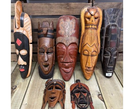 Selection of  seven African tribal wall mount masks. 50.5cm largest 