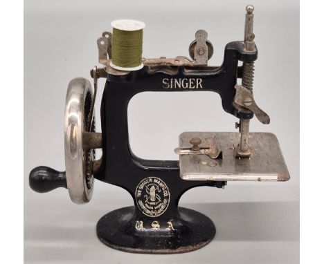 Child's Antique Singer sewing machine. Hand crank. 