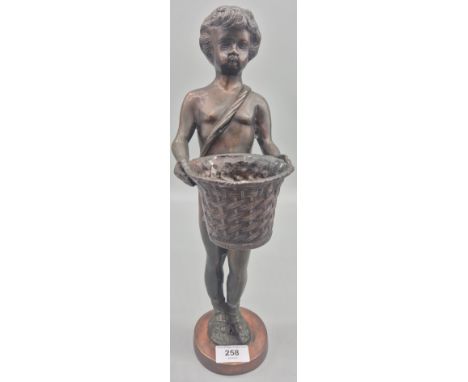 20th century Bronze sculpture of a boy holding a basket.  39cm in height. 