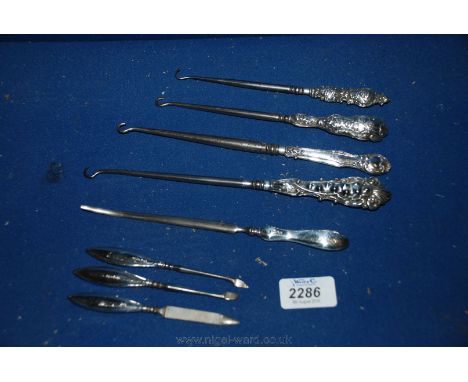 A quantity of Ladies silver handled Button Hooks, Manicure tools, etc.