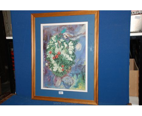 A framed Marc Chagall print.