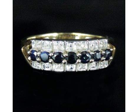 A 9 carat gold diamond and sapphire ring, boxed