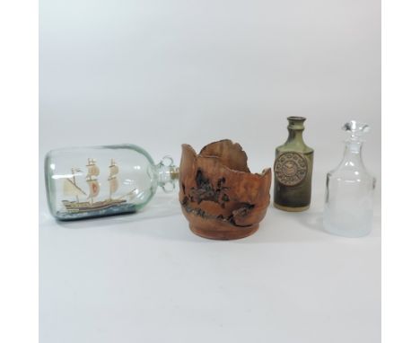 A model of a ship in a bottle, together with a Tremar whisky jar, a yew wood bowl and a decanter