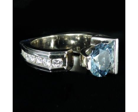 A 14 carat white gold aquamarine and diamond ring, boxed