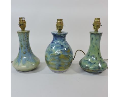 A Burslem pottery blue glazed lamp base, 25cm tall overall, together with two others similar