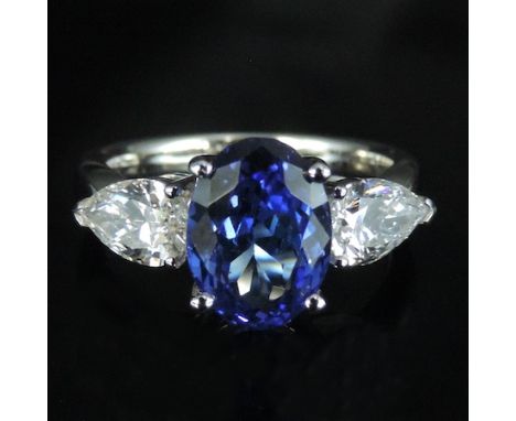 An 18 carat white gold tanzanite and diamond ring