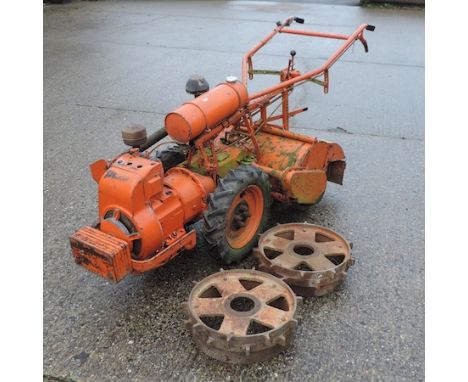 A petrol driven Howard 'The Gem' rotovator, series number G24, 30 inch blade, together with a garden roller