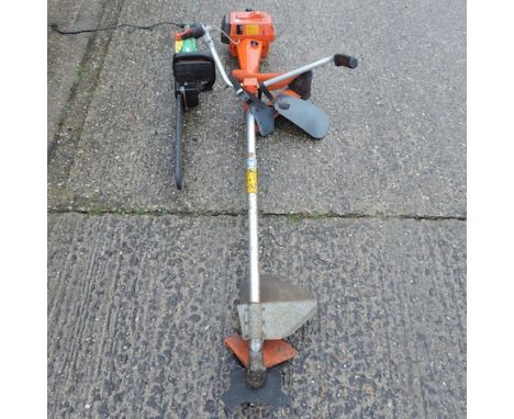 A Husqvarna petrol strimmer, together with an electric chainsaw