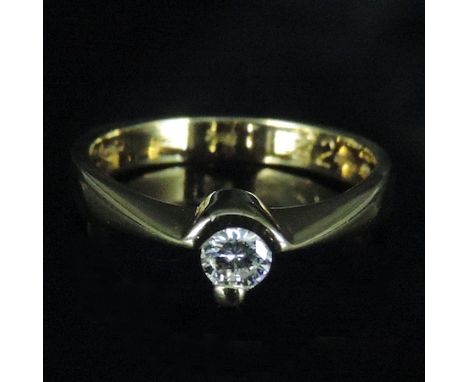 An 18 carat gold and diamond single stone ring, of asymmetric design