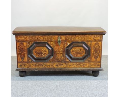 A 17th century and later continental oak and floral marquetry dome top trunk, inlaid with birds and flowers, on turned feet, 