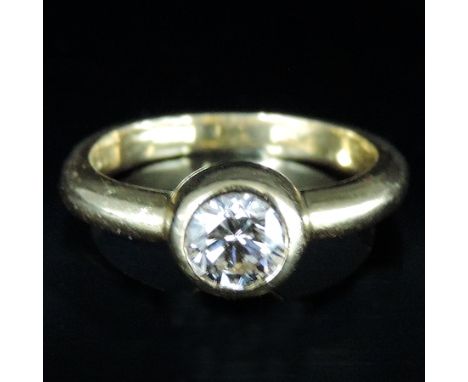An 18 carat gold collet set solitaire diamond ring, approx. 3/4 carat, boxed