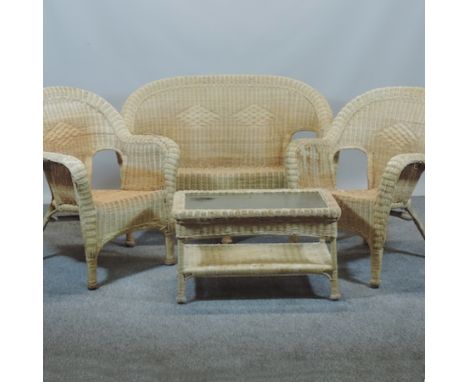 A wicker conservatory suite, comprising a sofa and two armchairs