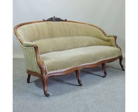 A 19th century French carved walnut and gold upholstered three seater sofa, on cabriole legs, 178cm