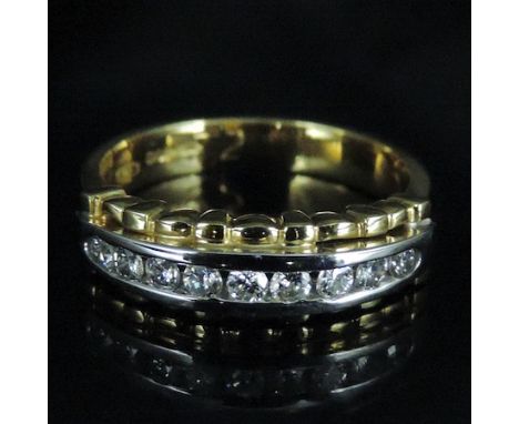 An 18 carat gold and diamond nine stone channel set half hoop eternity ring