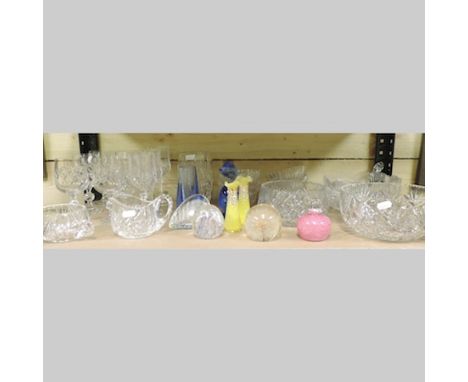 A shelf of cut and coloured glassware