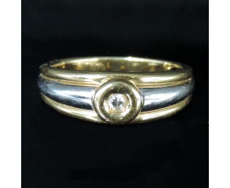 An 18 carat white gold and yellow gold diamond ring, boxed