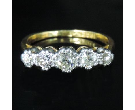 An 18 carat gold five stone diamond ring, boxed