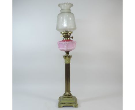 A Victorian brass corinthian column oil lamp, with an etched glass shade, 84cm tall