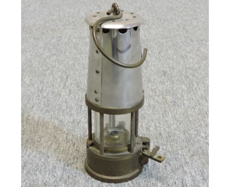 A vintage brass Eccles miner's lamp, 23cm tall