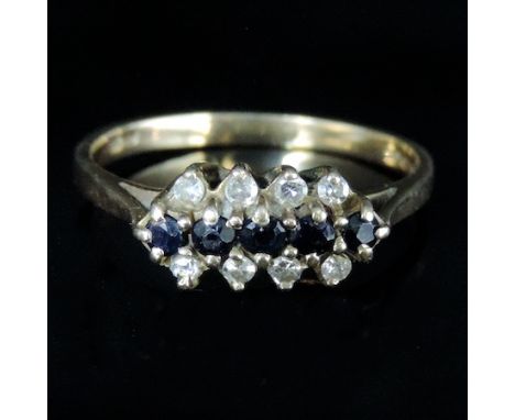 A 9 carat gold sapphire and diamond three row ring