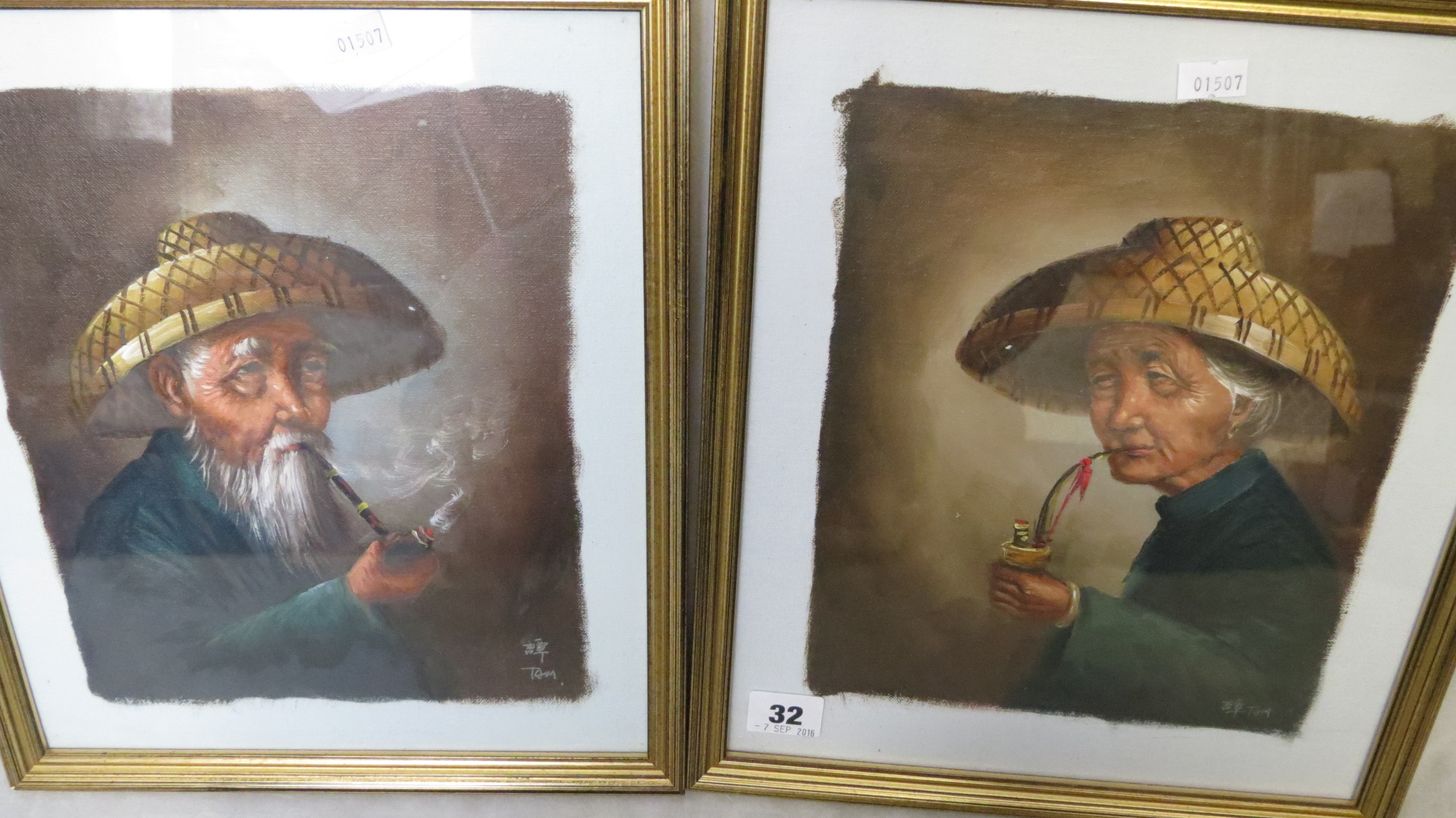 A Pair Of Asian Oil On Canvas Paintings Of An Old Man And Woman Smoking A Tobacco Pipe Each Sign