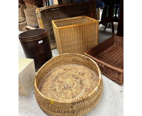 A collection of four various cane work baskets, cylindrical waste paper bin and a painted waste paper bin, a collection of Bu