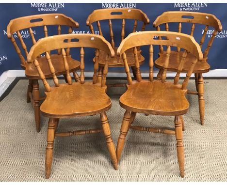 A set of five modern beech framed yoke and stick back kitchen chairs