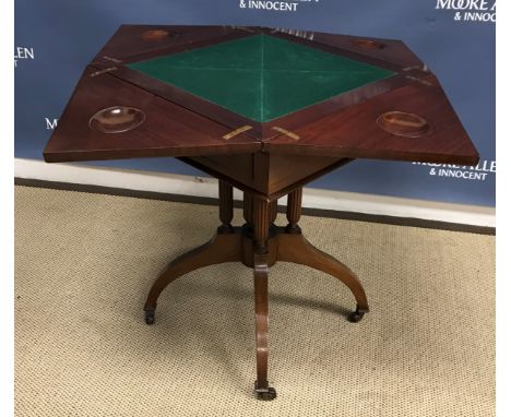 An Edwardian mahogany envelope card table with single frieze drawer on cluster column support to splayed square tapered legs 