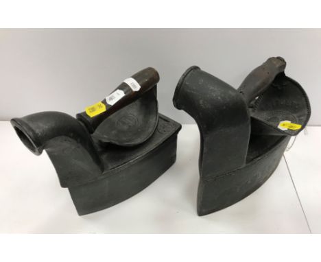An Archibald Kenrick &amp; Sons Carolina iron, right facing, an AER Carolina style iron with knuckle protector, front facing,