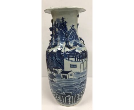 A 19th Century Chinese blue and white vase with relief dragon decoration to the narrow neck, the main body decorated with fig