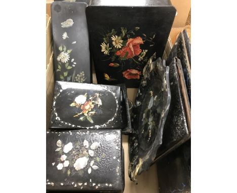 A collection of various Victorian and later black lacquered papier-mâché and other wares to include two blotters, small tray,
