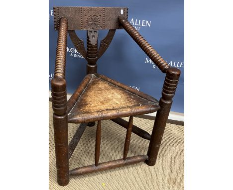 A 19th Century turned oak armchair in the 17th Century manner, the bar back with sloping bobbin turned arms on turned and rin