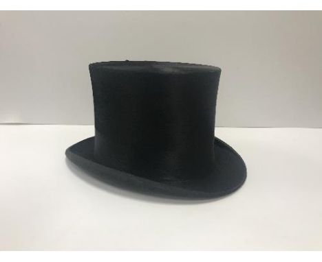 A silk top hat by The City Cork Hat Company Ltd, light hat specialists London, interior measurements 19.4 cm x 15.6 cm  CONDI