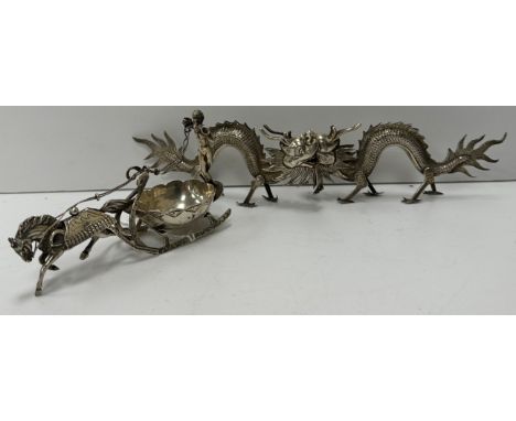 A Victorian silver miniature model of a horse pulling a sleigh with Classical figure of a man with horn (bears foreign import